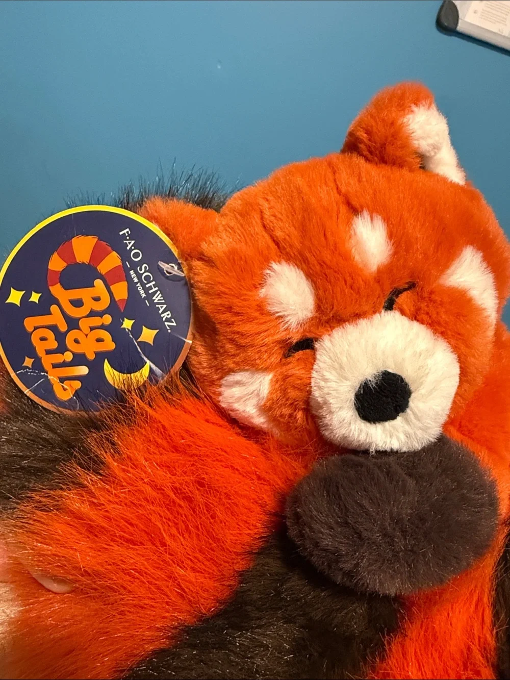 BNWT FAO Schwarz Orange and Black Sleeping Red Panda Plush.